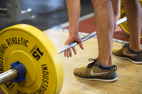 Person preparing to lift a barbell